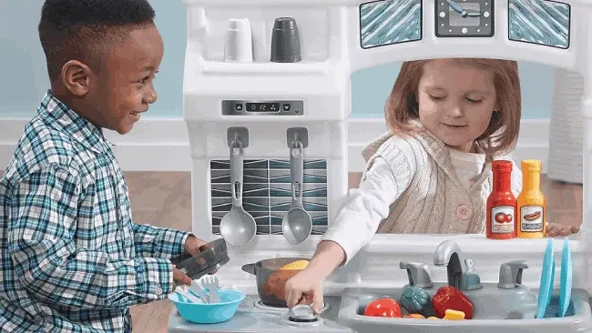 How does a play kitchen help a child's cognitive development